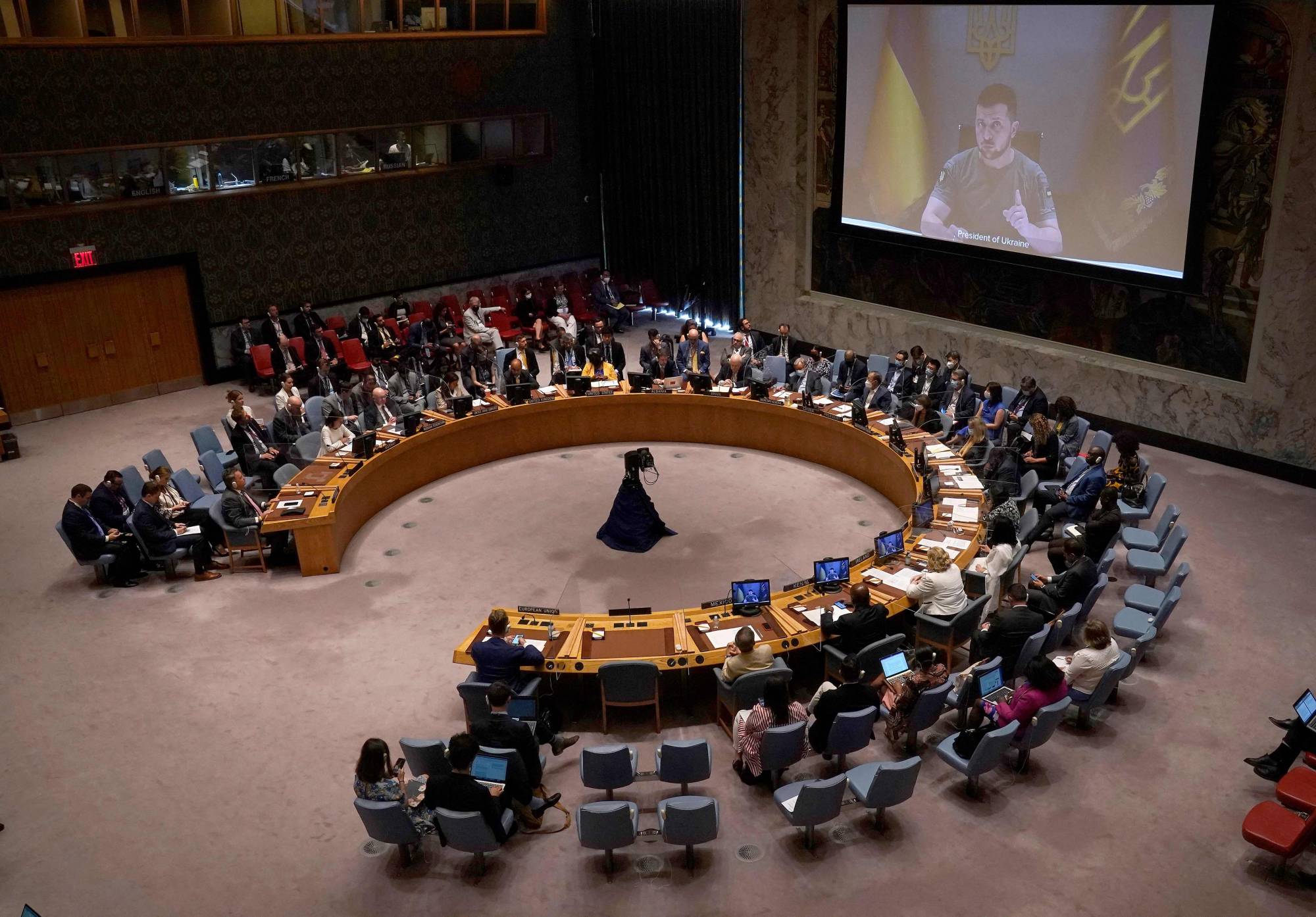 Ukrainian President Volodymyr Zelenskyy appears on a screen as he addresses a U.N. Security Council meeting on the war in Ukraine on Aug. 24 at United Nations headquarters in New York. | AFP-JIJI