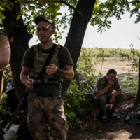 Anatolii Mohyla (far left), a Ukrainian military commander, with troops near the front line outside of Bakhmut.  | JIM HUYLEBROEK / THE NEW YORK TIMES