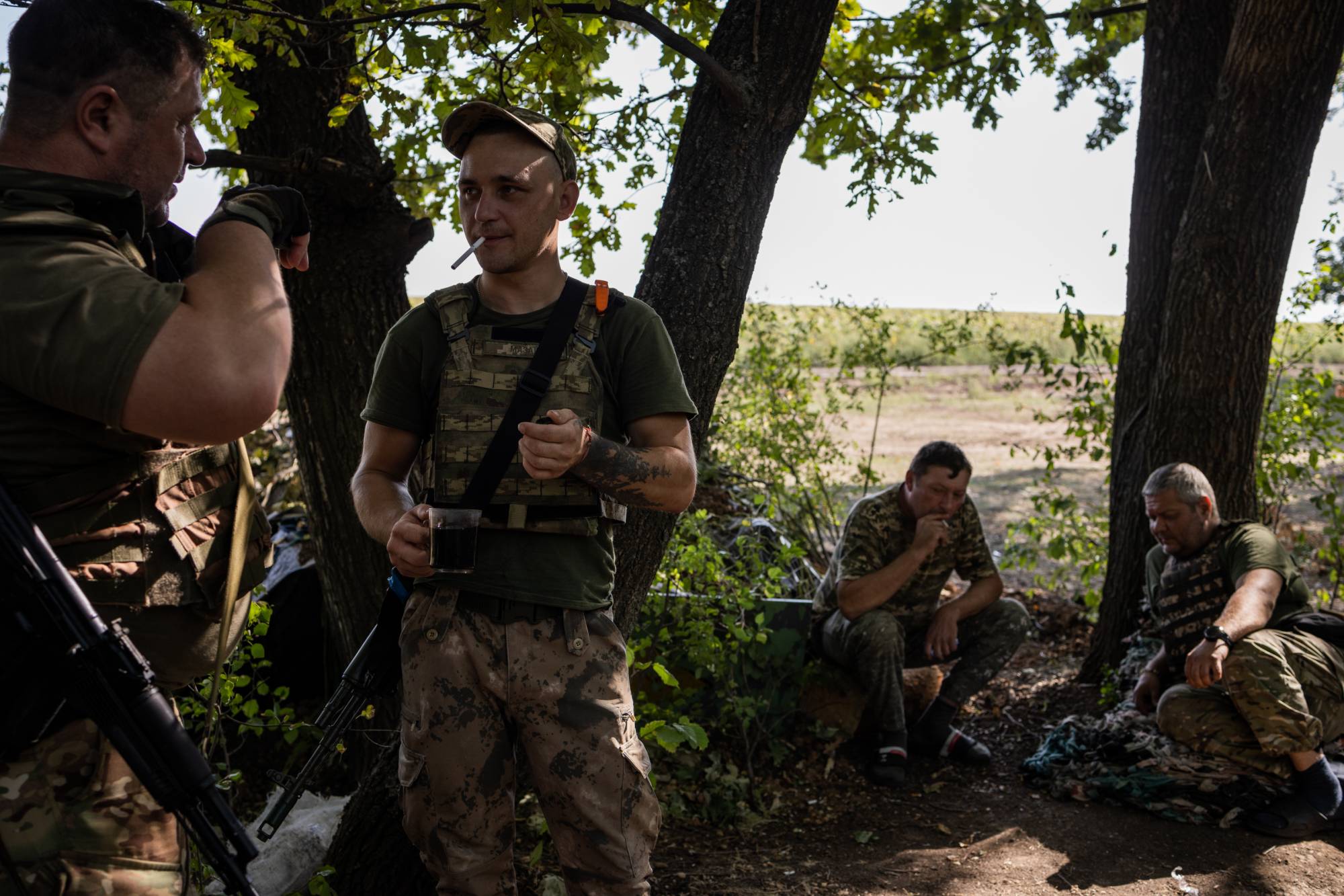 Anatolii Mohyla (far left), a Ukrainian military commander, with troops near the front line outside of Bakhmut. | Jim Huylebroek / The New York Times