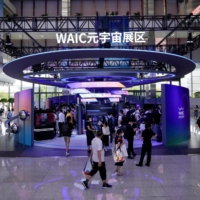 People visit a metaverse booth during the World Artificial Intelligence Conference in Shanghai on Sept. 1.  | REUTERS