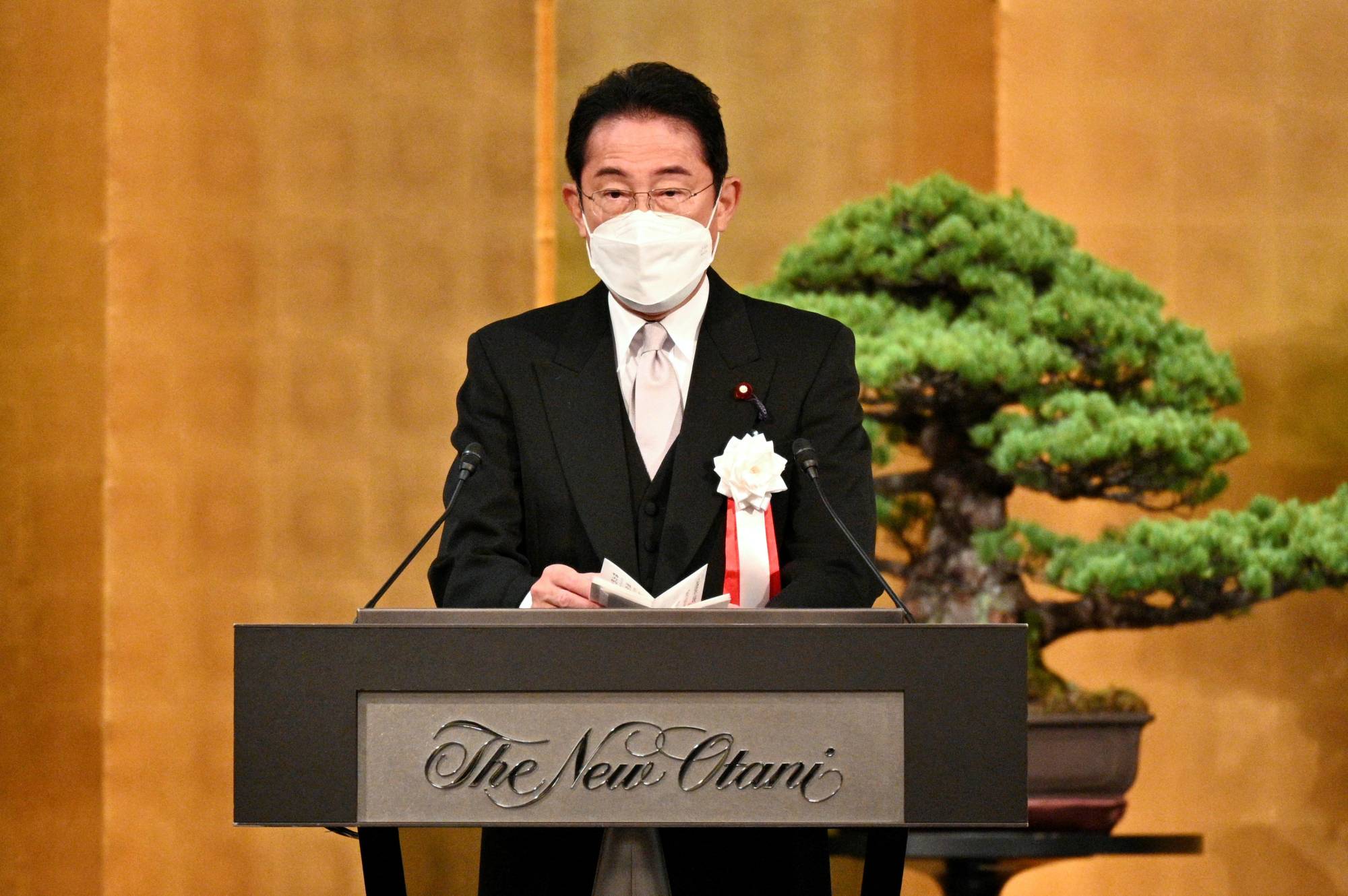 Prime Minister Fumio Kishida delivers a speech at a ceremony for the 75th founding anniversary of the Japan War-Bereaved Family Association at a hotel in Tokyo on Sept. 12.  | POOL / VIA REUTERS