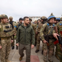 Ukrainian President Volodymyr Zelenskyy visits the town of Izium on Wednesday. The area was recently liberated by the Ukrainian military during counteroffensive operations against occupying Russian forces. | REUTERS 