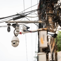 Surveillance cameras in a residential neighborhood in Beijing. A key part of China\'s Belt and Road initiative is the so-called Digital Silk Road — an initiative that aims to build modern telecommunications and data infrastructure among nations lying on the ancient Silk Road trade route. | BLOOMBERG