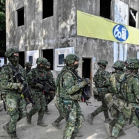 Taiwanese soldiers take part in a drill at an army base in Kaohsiung, Taiwan, in January | AFP-JIJI