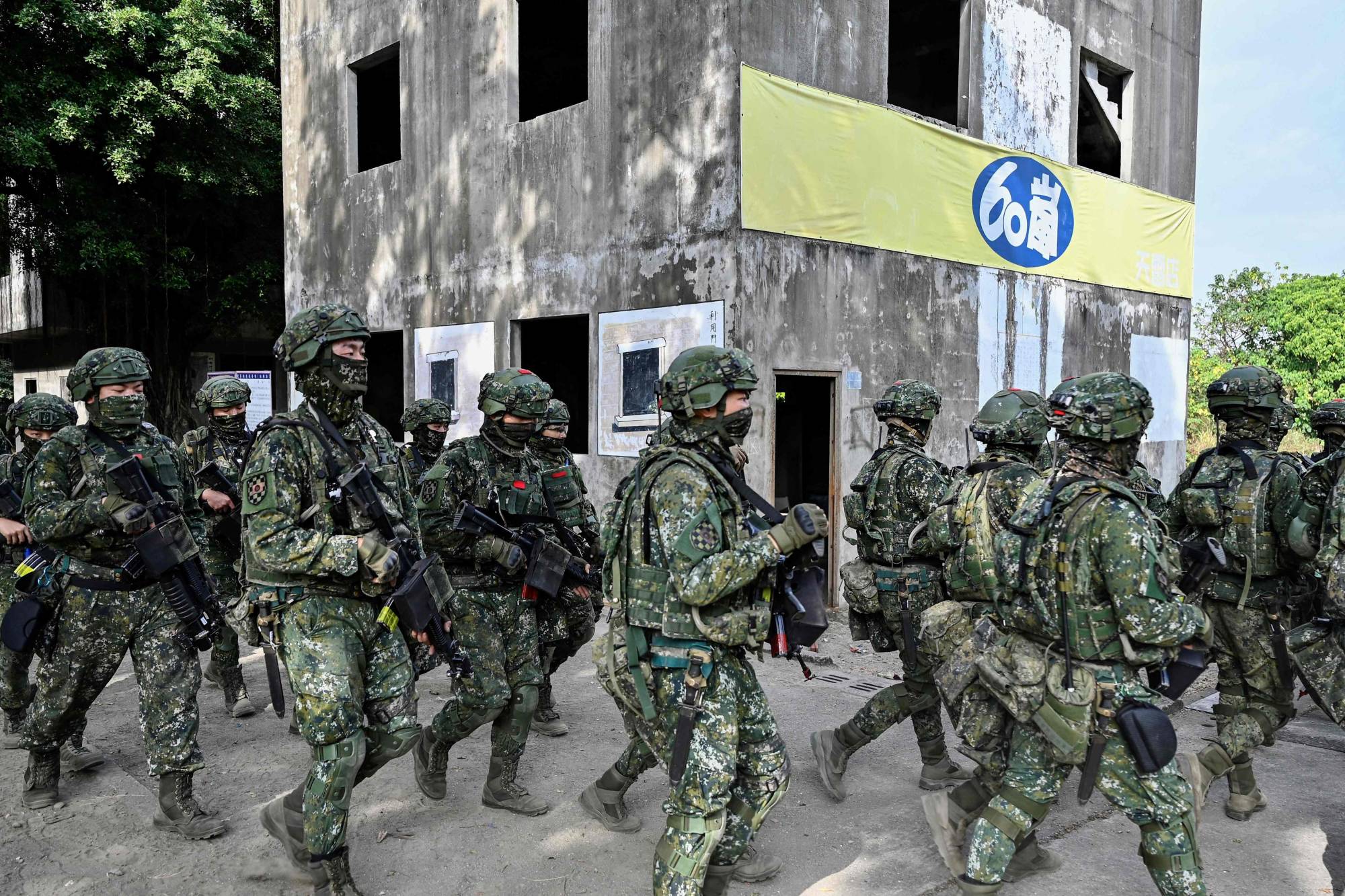 Taiwanese soldiers take part in a drill at an army base in Kaohsiung, Taiwan, in January | AFP-JIJI
