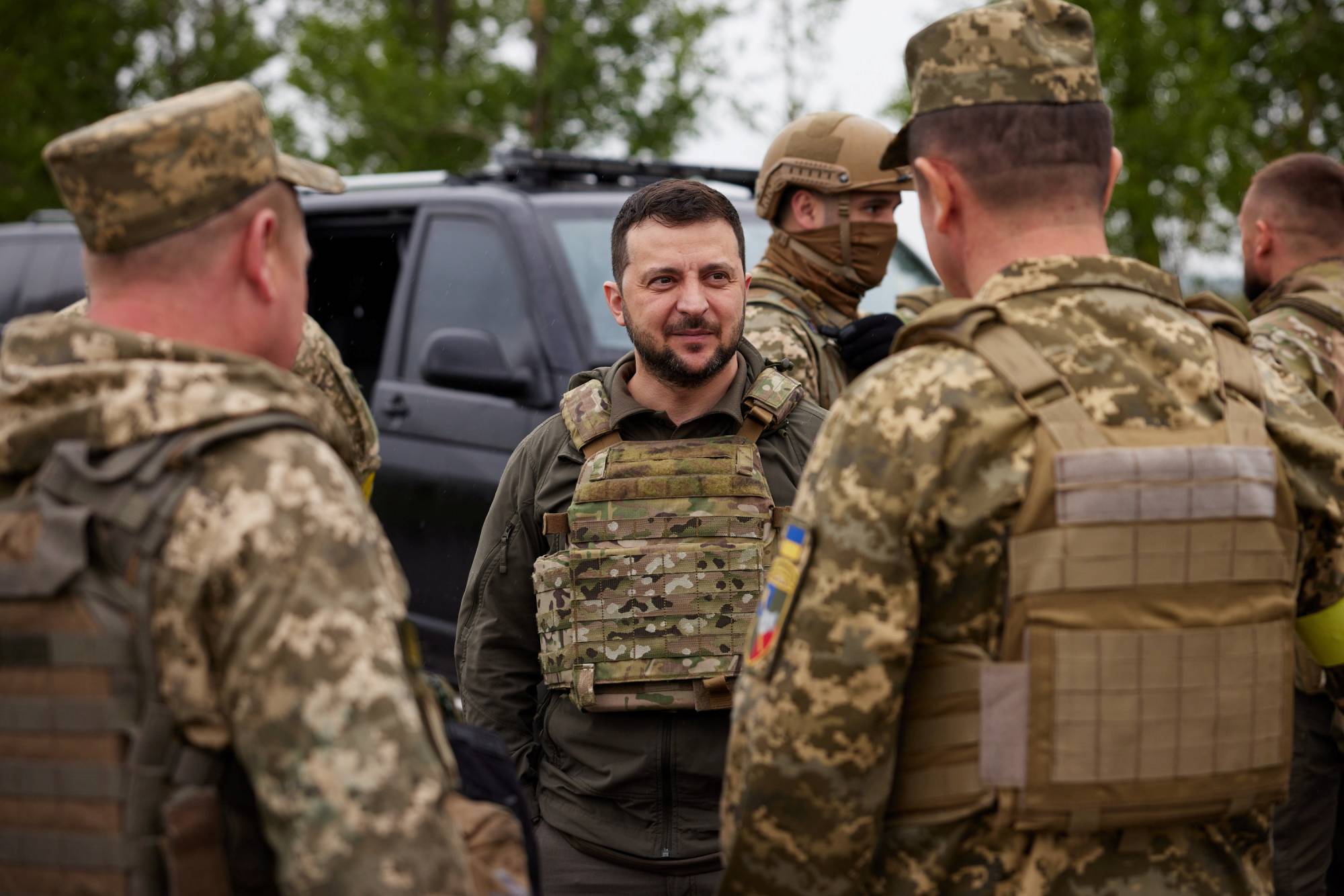 Ukrainian President Volodymyr Zelenskyy speaks with Ukrainian troops in Kharkiv region, Ukraine, on May 29. | UKRAINIAN PRESIDENTIAL PRESS SERVICE / VIA REUTERS