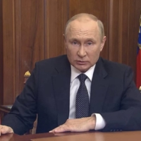 Russian President Vladimir Putin makes an address, dedicated to a military conflict with Ukraine, in Moscow, on Wednesday. | RUSSIAN PRESIDENTIAL PRESS SERVICE / KREMLIN / VIA REUTERS 