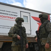 Russian service members at a mobile recruitment center for military service under contract in Rostov-on-Don, Russia, on Saturday. | REUTERS