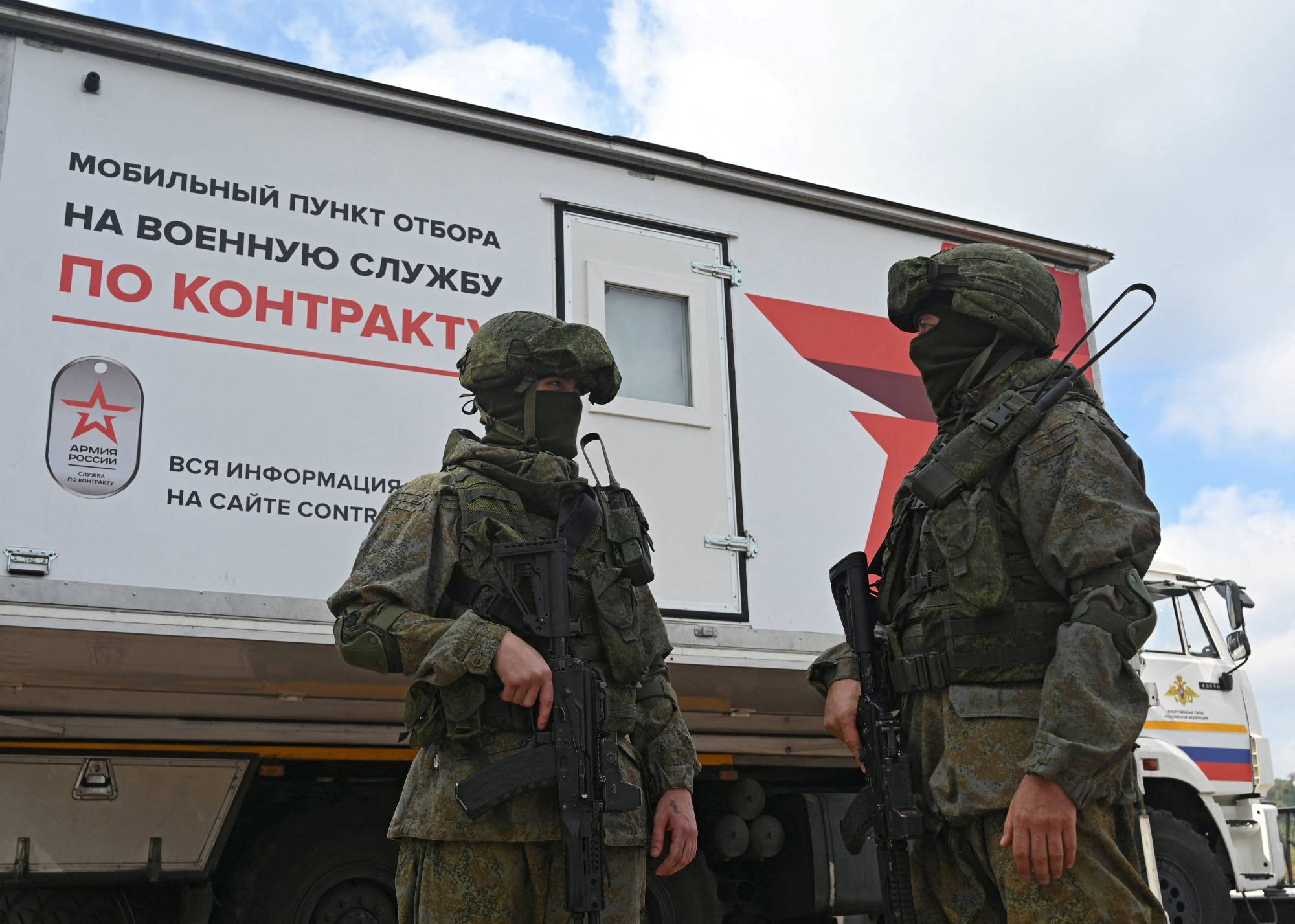 Russian service members at a mobile recruitment center for military service under contract in Rostov-on-Don, Russia, on Saturday. | REUTERS