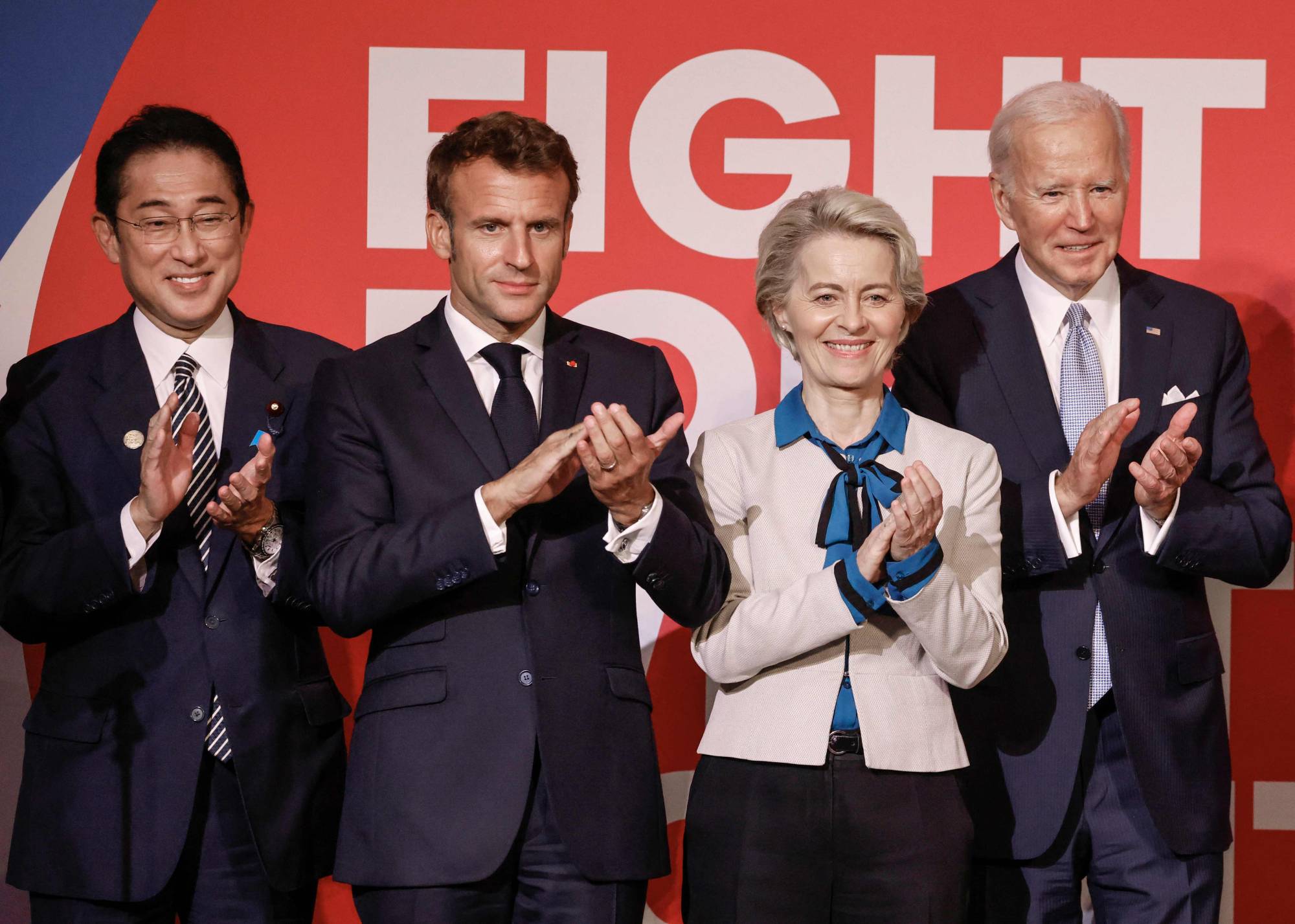 Prime Minister Fumio Kishida, French President Emmanuel Macron, EU Commission President Ursula von der Leyen and U.S. President Joe Biden applaud at the Global Fund's Seventh Replenishment Conference in New York on Wednesday. | AFP-JIJI