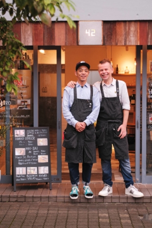 Fumihiro Tanaka and Stephen Milne stand in front of 42, a cafe in Tokyo's Higashinagasaki neighborhood that sells Ojizo Coffee. | STEPHAN JARVIS