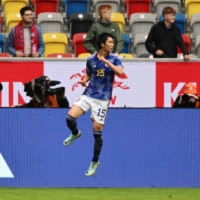 Japan\'s Daichi Kamada celebrates after scoring the opening goal against the U.S. in a friendly in Dusseldorf, Germany, on Friday.  | REUTERS