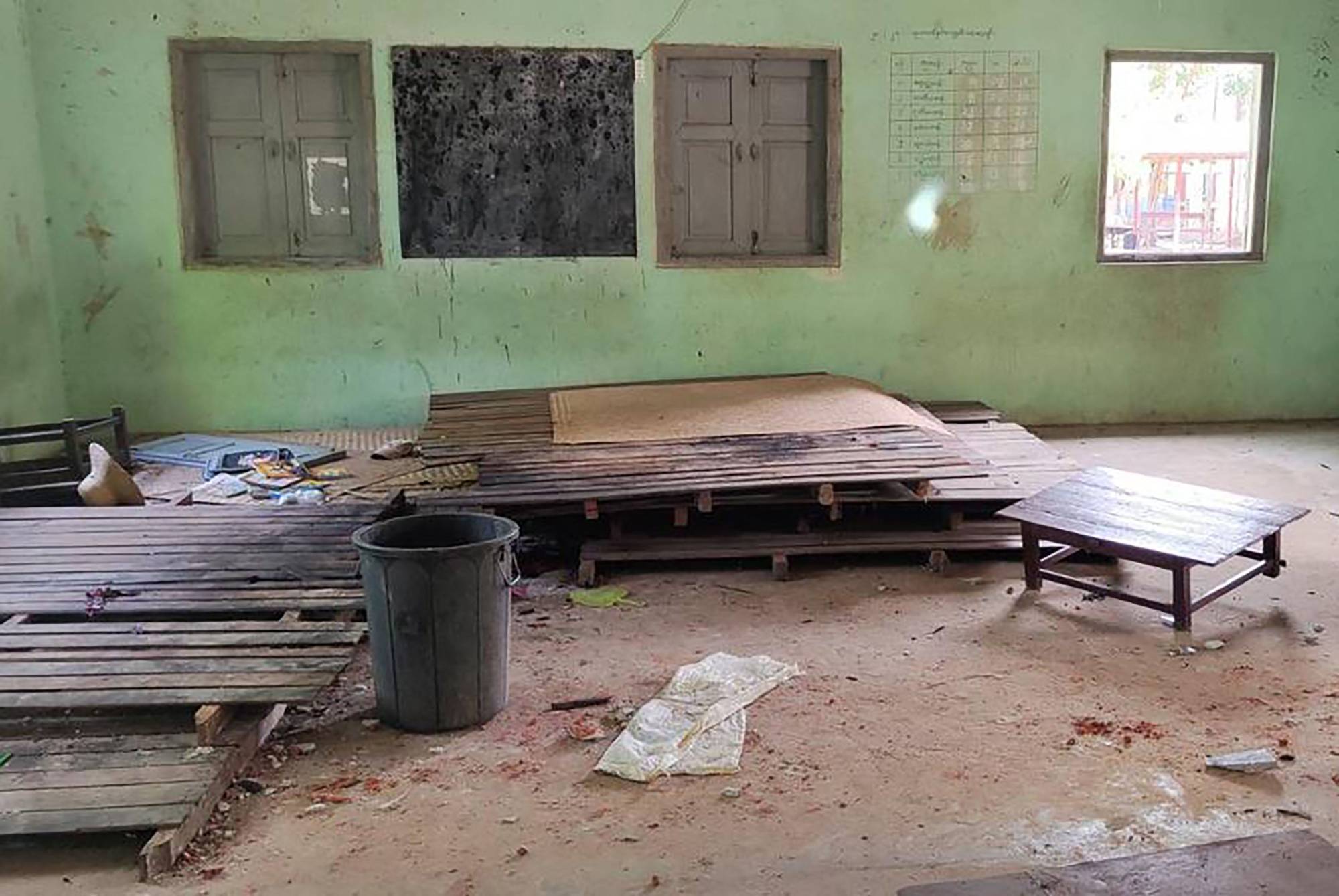 Debris and bloodstains on the floor of a damaged school building in Myanmar's northwest Sagaing region. Eleven schoolchildren were killed in an attack by a Myanmar military helicopter.  | AFP-JIJI