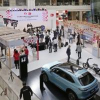 An event to commemorate the 50th anniversary of ties between Japan and China is held at a shopping mall in Beijing on Saturday.  | KYODO 