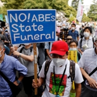 Protesters attend a rally against the state funeral for Abe in Tokyo on Tuesday. | REUTERS