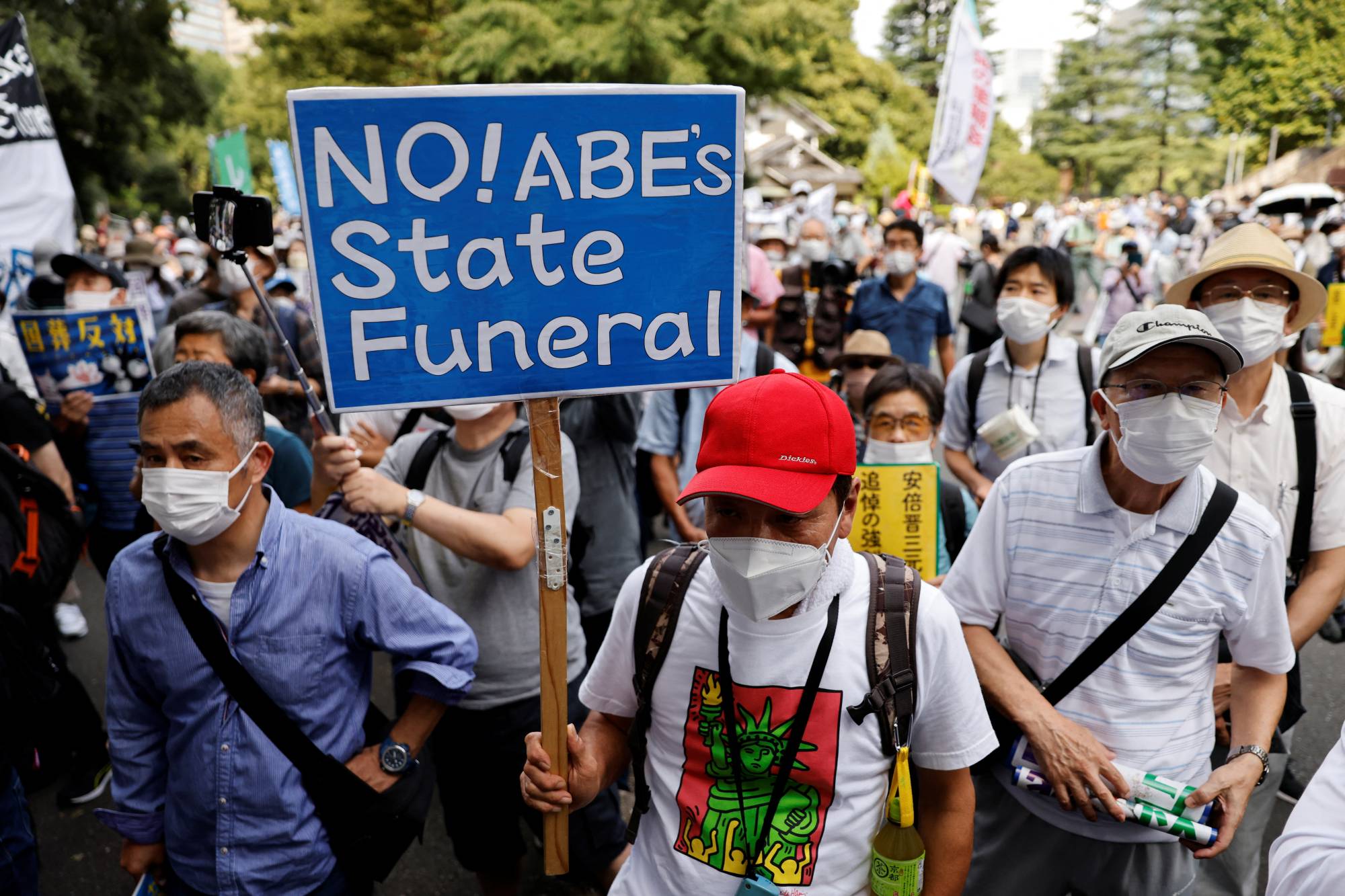Protesters attend a rally against the state funeral for Abe in Tokyo on Tuesday. | Reuters