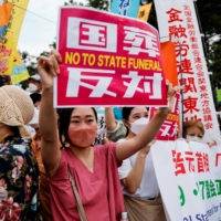 Protesters demonstrate outside the parliament building. | REUTERS