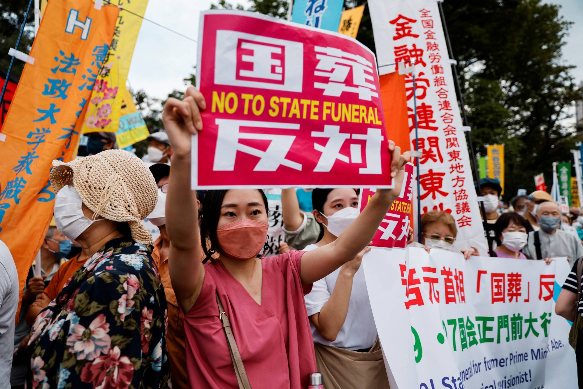 Protesters demonstrate outside the parliament building. | REUTERS
