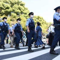 About 20,000 police officers were mobilized for the state funeral. | BLOOMBERG