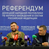 Denis Pushilin (center), the head of the separatist self-proclaimed Donetsk People\'s Republic, at a news conference on the preliminary results of a referendum on joining Russia that the West has labeled a \"sham,\" in Donetsk, Ukraine, on Tuesday. | REUTERS