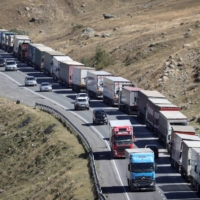 Travelers from Russia after crossing the border to Georgia at the Zemo Larsi/Verkhny Lars station, on Monday. | REUTERS