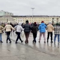 Demonstrators do a traditional dance during a protest against Russia\'s partial military mobilization in Yakutsk, Russia, on Sunday. | SAKHADAY / VIA REUTERS.  