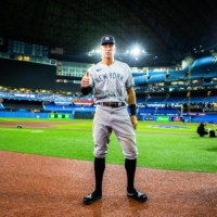 New York Yankees outfielder Aaron Judge conducts postgame interviews after hitting his 61st home run of the season, at the Rogers Centre in Toronto on Wednesday. | CHRIS DONOVAN / THE NEW YORK TIMES