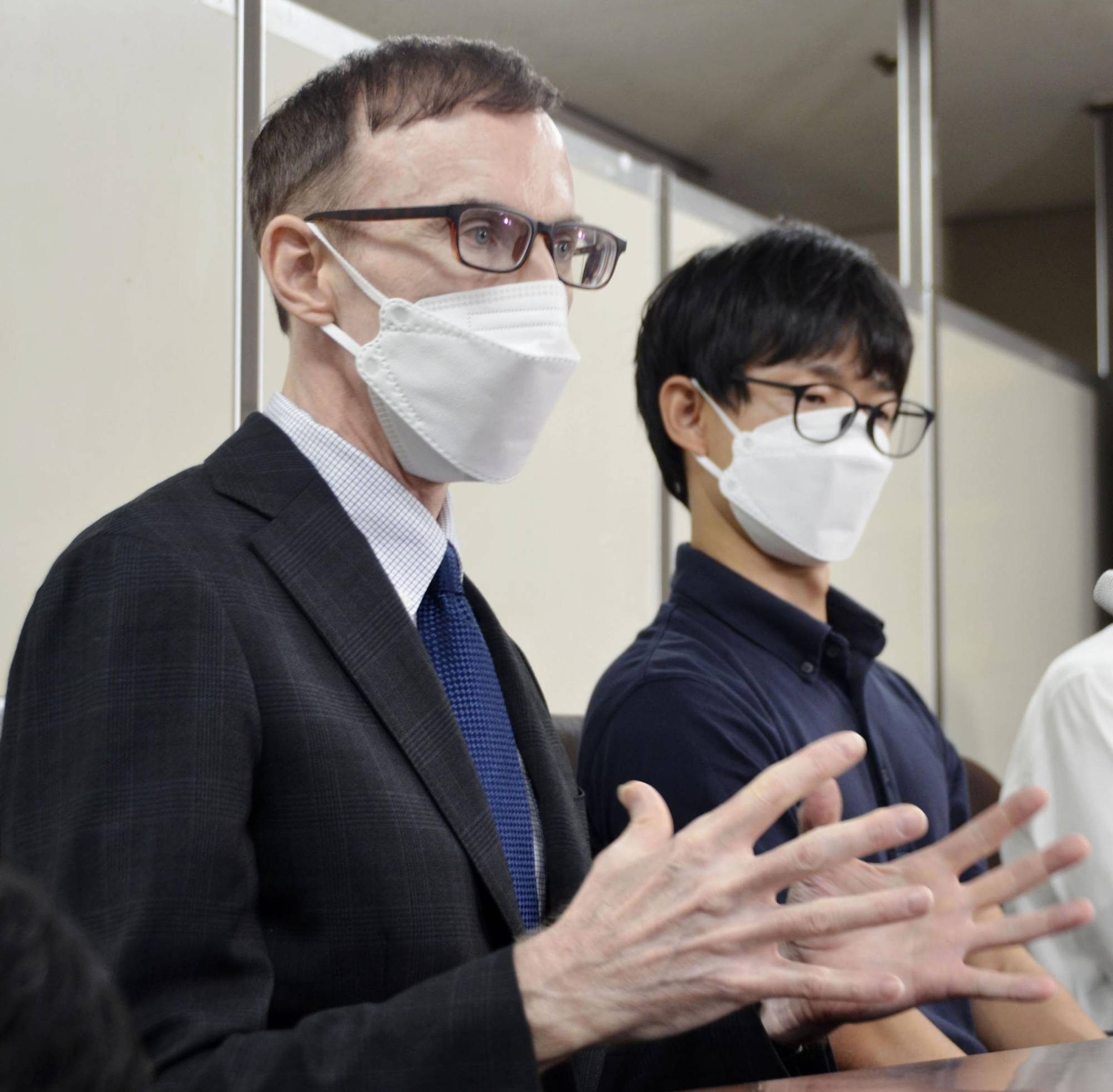 Andrew High (left) and his Japanese husband, Kohei, attend a news conference at the Tokyo District Court on Friday. | KYODO
