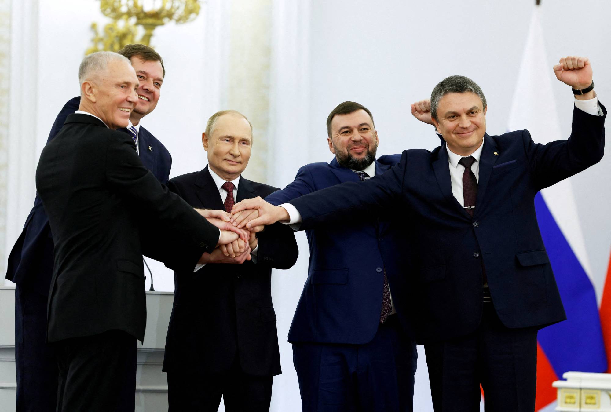 Russian President Vladimir Putin attends a ceremony with the Russian-installed leaders of Ukraine's Donetsk, Luhansk, Kherson and Zaporizhzhia regions to declare their annexation, at the Kremlin in Moscow on Friday. | Sputnik / Pool / via REUTERS