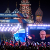Russian President Vladimir Putin addresses a rally in Moscow on Friday.  | AFP-JIJI