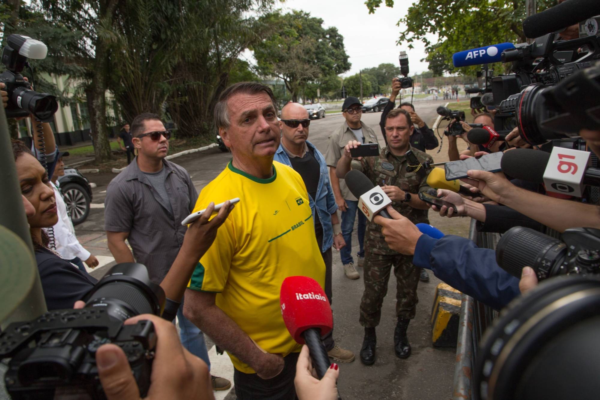 Brazilian President Jair Bolsonaro speaks to members of the media after casting his ballot at a polling station in Rio de Janeiro on Sunday. | Bloomberg
