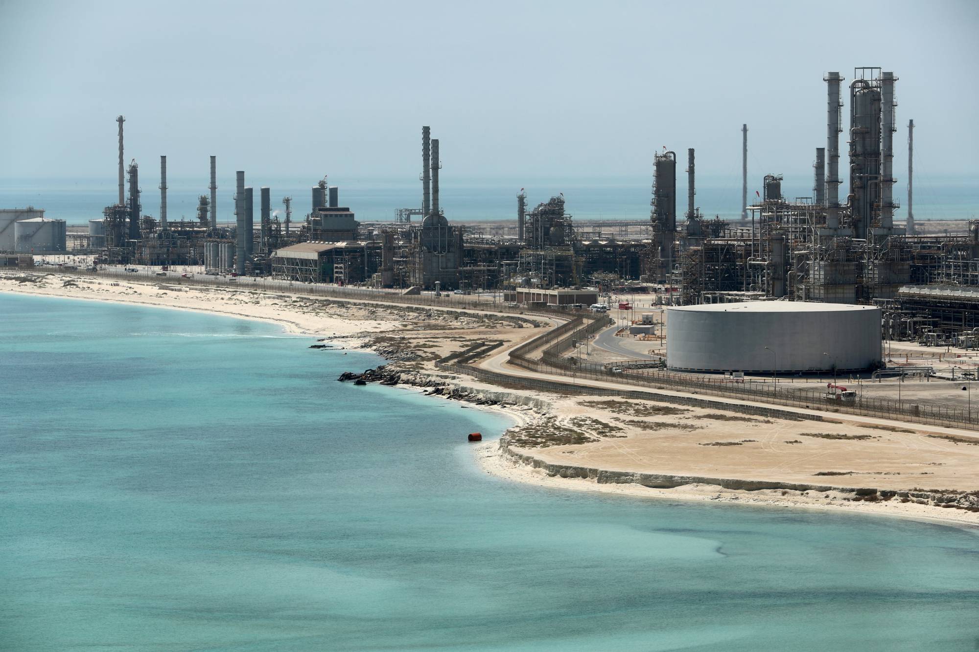 Saudi Aramco's Ras Tanura oil refinery and oil terminal in Saudi Arabia. Analysts say that the Saudis appear determined to bring oil prices up to about $90 a barrel. | REUTERS 