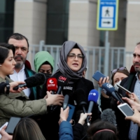 Hatice Cengiz, fiancee of the murdered Saudi journalist Jamal Khashoggi, talks to the media outside Justice Palace, the Caglayan Courthouse, after attending a trial on the killing of Khashoggi at the Saudi Arabian Consulate in Istanbul, in April. | REUTERS