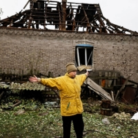 A woman speaks to journalists following a Russian missile strike in Kramatorsk, in Ukraine\'s Donetsk region, on Tuesday.  | REUTERS 