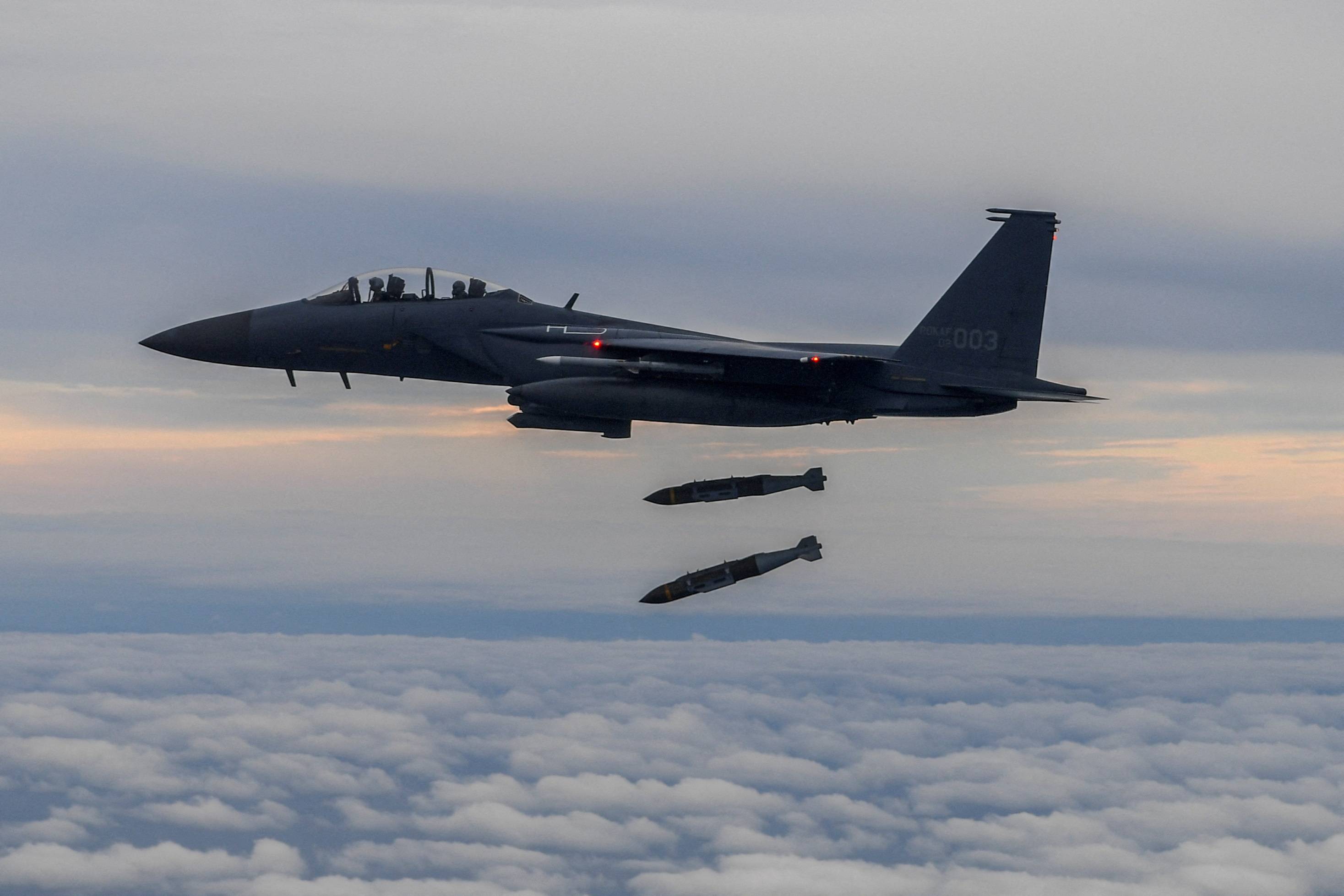 A South Korean Air Force F-15K fighter jet takes part in a joint bombing drill with the U.S. military on Tuesday.  | SOUTH KOREAN DEFENSE MINISTRY / YONHAP / VIA REUTERS