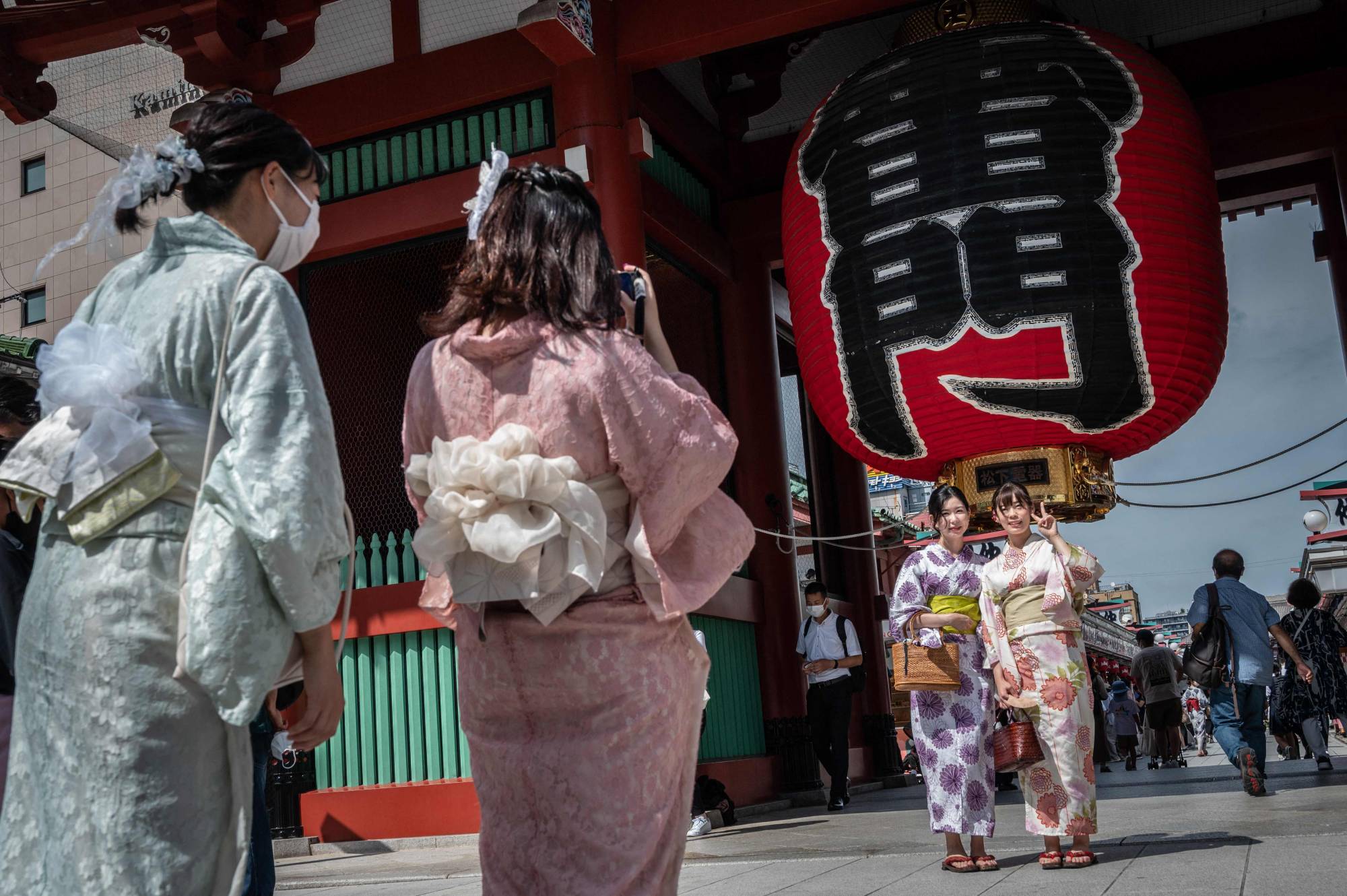 People visit Sensoji temple, a popular tourist destination, in Tokyo on Sept. 13. | AFP-JIJI