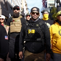 Members of the far-right Proud Boys group, including their leader Enrique Tarrio (center right), protest over the results of the 2020 U.S. presidential election in Washington on Nov. 14, 2020. | REUTERS