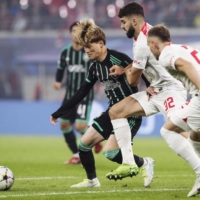 Celtic\'s Kyogo Furuhashi (left) vies for the ball during a Champions League match against Leipzig in Leipzig, Germany, on Wednesday. | KYODO