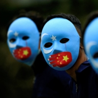 Activists take part in a protest against China\'s treatment of the ethnic Uyghur people at a park Jakarta in January. The defeat of a Western-led motion to hold a debate about alleged human rights abuses by China against Uyghurs is seen by observers as a setback for the credibility of the United Nations. | REUTERS 