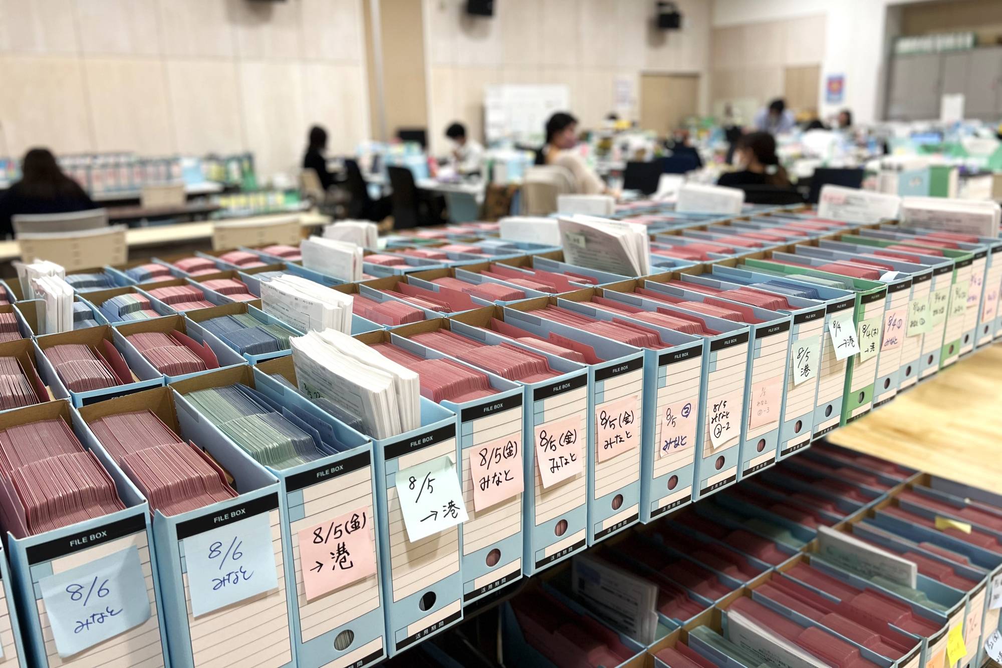 Boxes containing case files of COVID patients at Minato Public Health Center in Tokyo’s Minato Ward. | TOMOKO OTAKE