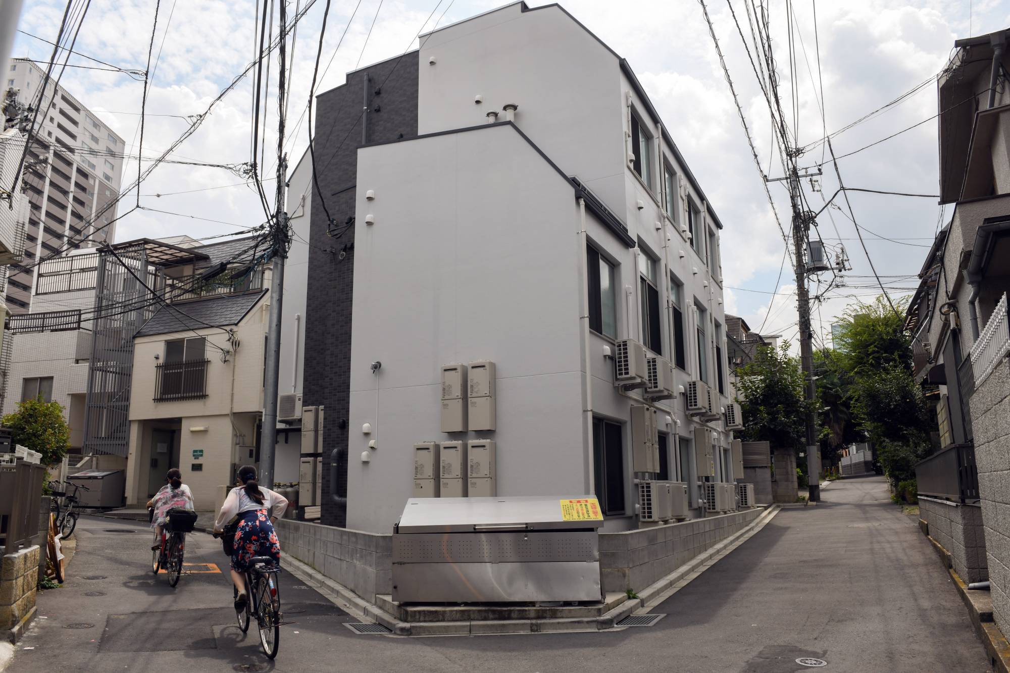 A building housing tiny apartments in Tokyo on Aug. 24. New apartments in Japan are pushing the boundaries of normal living. | Noriko Hayashi / The New York Times