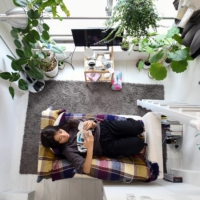 Kana Komatsubara, 26, in her apartment in Tokyo on Sept. 24.  Tiny new apartments in Japan are pushing the boundaries of normal living.  | NORIKO HAYASHI / THE NEW YORK TIMES