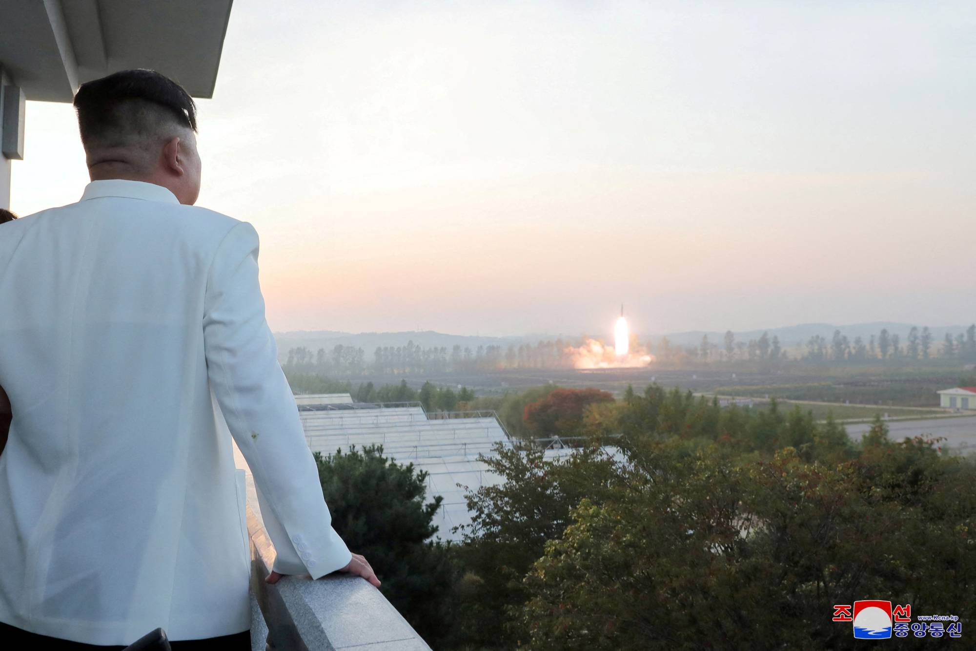 North Korean leader Kim Jong Un oversees a missile launch at an undisclosed location in the country in this photo released Monday. | KCNA / VIA REUTERS    