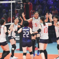 Japan celebrates after a point against the Netherlands during the women\'s volleyball world championship in Rotterdam, Netherlands, on Sunday. | KYODO