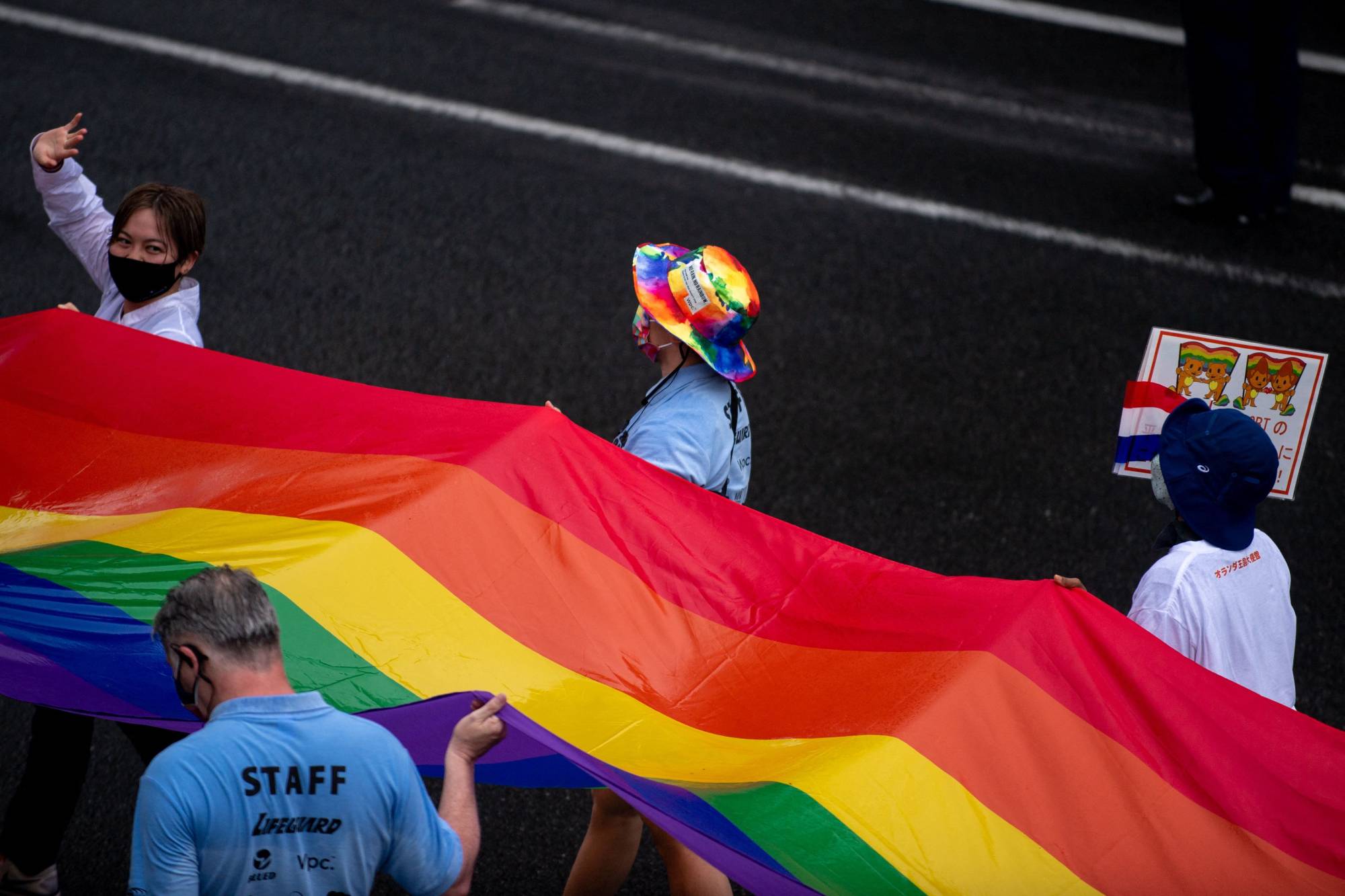People attend the Tokyo Rainbow Pride 2022 parade in Tokyo on April 24. | GETTY IMAGES / VIA BLOOMBERG