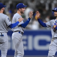 Mookie Bets (right) and Trea Turner (center) are among a strong Dodgers roster that claimed the team\'s ninth NL West title in 10 years this season. | USA TODAY / VIA RETUERS