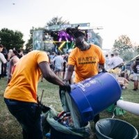 Compost bins are emptied at Deep Tropics. There were no trash cans at the festival (though plenty of recycling and compost bins).  | TAYLOR BAUCOM / THE NEW YORK TIMES