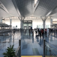 Haneda Airport in Tokyo on Tuesday. Japan officially opened its borders at midnight on Monday night, completely removing the 50,000 daily cap on new arrivals in place since early September. | WILL FEE
