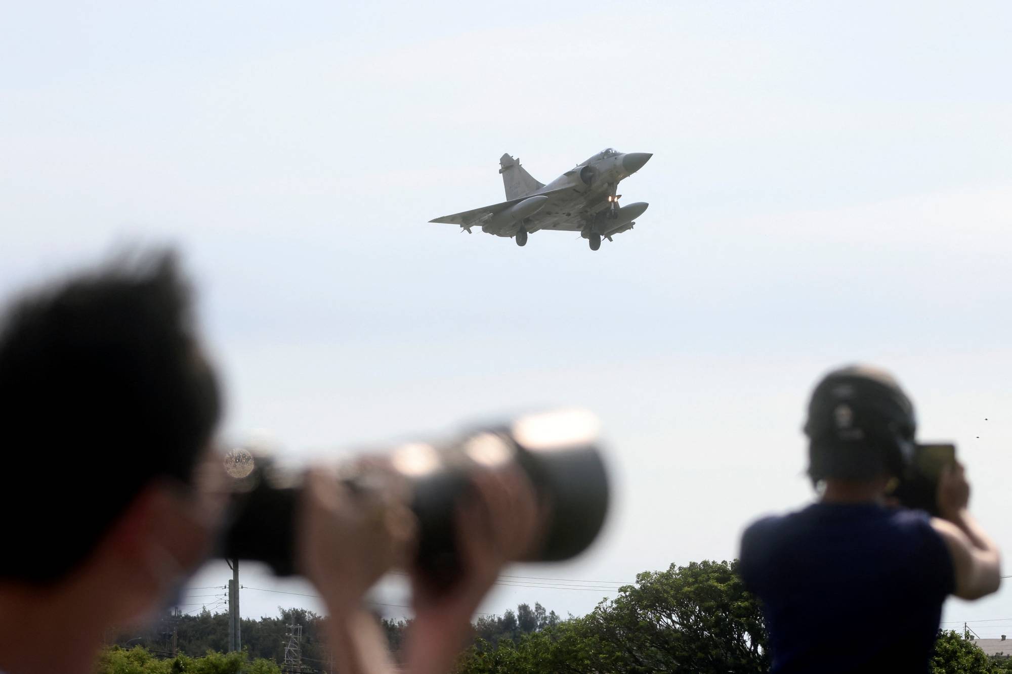 A Taiwan Air Force Mirage 2000-5 aircraft lands at Hsinchu Air Base in Hsinchu, Taiwan, on Aug. 7. | Reuters
