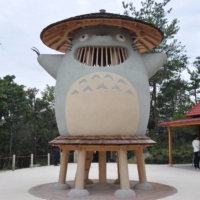 A replica of Totoro sits in a clearing inside Ghibli Park. | THU-HUONG HA